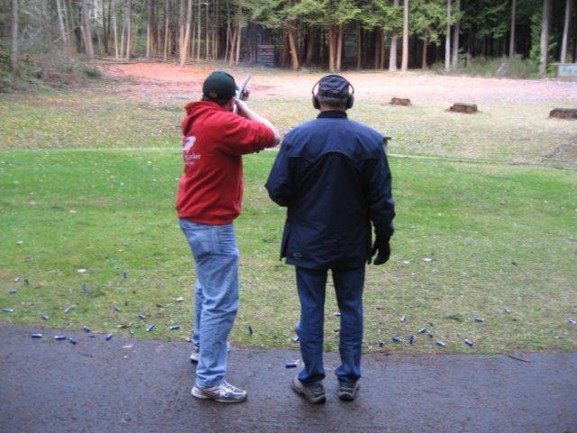 Shooters fire at clay targets on the shotgun range.