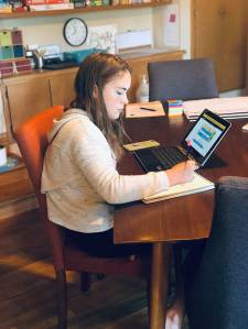 8th-grader Maia doing her school work from home in September 2020. Courtesy Photo