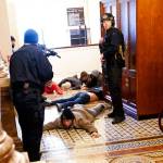 Capitol Police subdue insurrectionists who illegally entered the halls of the Capitol Building. (Courtesy of KUOW)