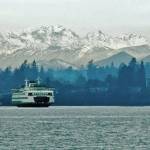 Bainbridge Island finally got its winter snow this week, but it only lasted a few days. Rebecca Barker said her family moved here two years ago from Canada and got a little slice of home with the snow as Michael, 6, built a snowman, complete with the COVID-19 safety mask of course. Meanwhile, Jim Beyea dug up this photo of the ferry in Bainbridge Island pulling out of the dock with the Olympics in the background. The National Weather Service issued a winter storm warning for the Bainbridge Island area Saturday. Last Thursday, city Operations Maintenance crews began working 12-hour shifts to provide 24-hour coverage. The city followed its Snow and Ice Control Plan that includes priority streets for response; crews focus first on main roads then neighborhood streets. The city is not operating the Severe Weather Shelter on Bainbridge Island this year due to COVID-19. But the Kitsap County Severe Weather Shelter in Poulsbo has been open at the Gateway Fellowship Church, 18901 8th Ave. Subscribe to shelter activation notifications by texting KITSAPSWS to 898-211. 
Courtesy photos