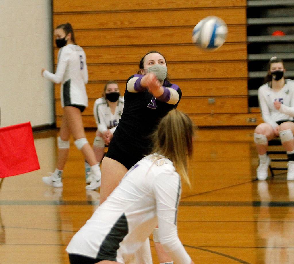 North Kitsap libero Autumn Carver digs out a spike. (Mark Krulish/Kitsap News Grouop)
