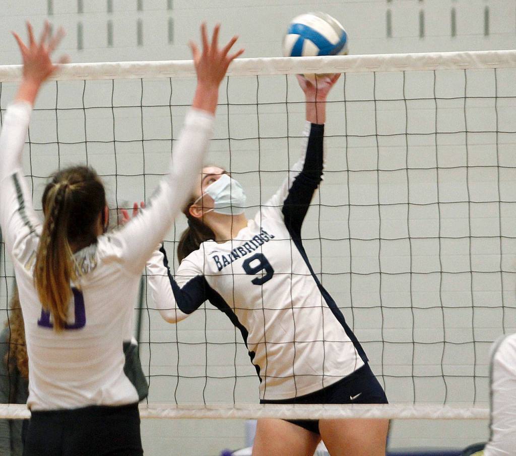 Bainbridge senior Lauren de Gall looks to send a spike past the North Kitsap defense. (Mark Krulish/Kitsap News Group)