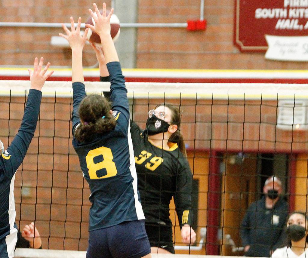 South Kitsaps Anna Harvey tries to stuff the ball over the Bainbridge defense. (Mark Krulish/Kitsap News Group)