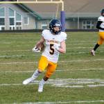 Cal Breen makes the reception and escapes into the open field against Sequim. (Mark Krulish/Kitsap News Group)