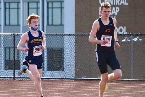 Bainbridges Alex Miller chases down Central Kitsaps Daniel Lizon in the second Olympic League meet of the season. Miller won the race with a time of 17:20.20. (Photo courtesy of Rick Peters)