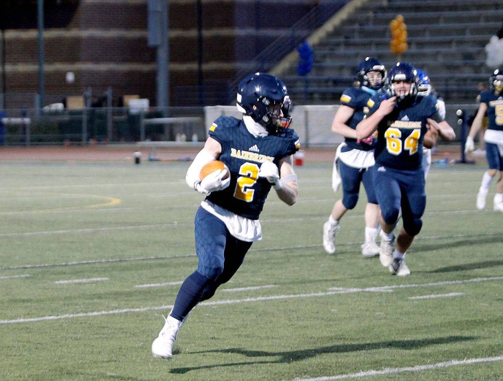 Bainbridges Jack Mielke takes a pass for a 25-yard gain against Olympic. (Mark Krulish/Kitsap News Group)