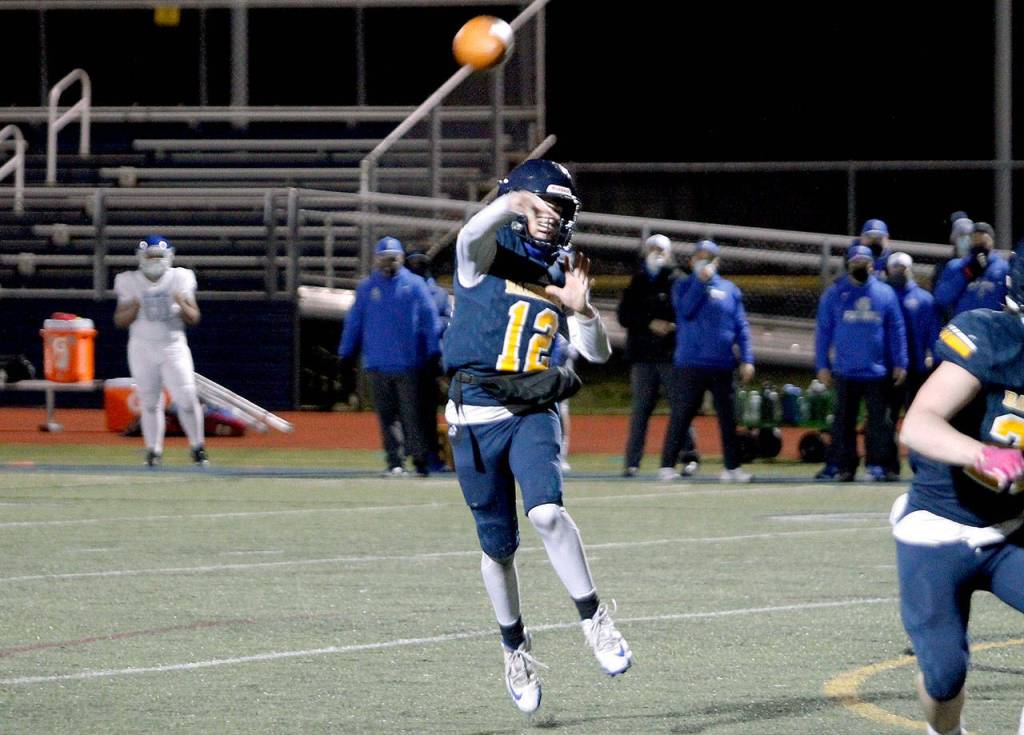 Bainbridge quarterback Gabriel Todd threw four touchdown passes, including the game-winner, against the Trojans. (Mark Krulish/Kitsap News Group)
