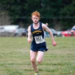Bainbridge junior Alex Miller finished second for the boys, followed closely by freshman Bodie Strom (right). (Mark Krulish/Kitsap News Group)