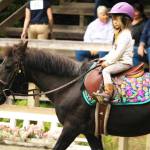 Kids start riding at the Saddle Club at a young age.
