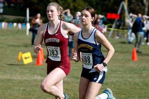 South Kitsaps Evelyn Collins-Winn (left) and Bainbridges Lily Curtis take off from the starting line at the Olympic League varsity championships at Battle Point Park. (Mark Krulish/Kitsap News Group)