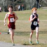 Kingstons Curtis Upton (left) and Bainbridges Alex Miller (right) run neck-and-neck early in the championship race. (Mark Krulish/Kitsap News Group)