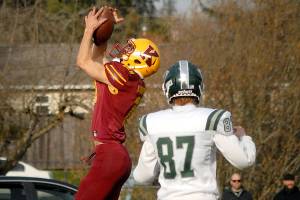 Keith Thorpe/Peninsula News Group
Kingston's Kyler Coe-yarr pulls down an interception from a pass intended for Port Angeles' Cyras Mills in the closing moments of the first half on Saturday in Port Angeles.