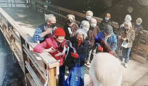 Bainbridge Island survivors of Japanese internment camps during World War II gather at the new dock at the exclusion memorial. Steve Powell/Bainbridge Island Review photos