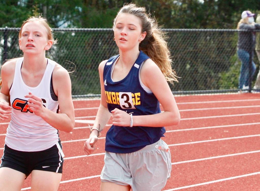 Lily Curtis runs neck-and-neck with Central Kitsaps Catherine Vlach in the 1600-meter run. (Mark Krulish/Kitsap News Group)