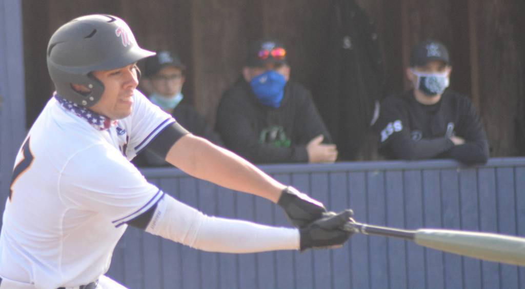 Angel Maldonado takes a swing at a pitch.