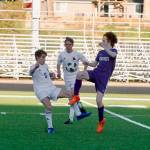North Kitsaps Sam Glass battles with Nick Pecora (left) and Calvin Moe (center) for a loose ball. (Mark Krulish/Kitsap News Group)