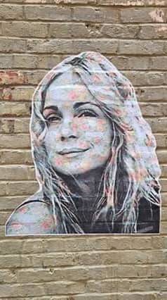 A friend of Kristas from childhood created a likeness of her on an art wall in downtown Seattle.