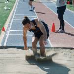 Isaac Agnew of Bainbridge makes his leap in the long jump. He finished seventh with a jump of 18 feet, 4.5 inches. (Mark Krulish/Kitsap News Group)