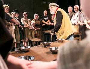 The cast of "Oliver" surrounds Ronald Milton. Courtesy Photo