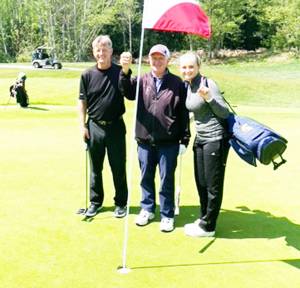 Jay Bowditch, center, got his first hole in one at the age of 83. He was at Wing Point Golf Club on Bainbridge Island on a sunny April 30. He used an 8 iron on Hole 2 from 100 yards away. It was witnessed by four family members, including his granddaughter Kendall. Courtesy Photo