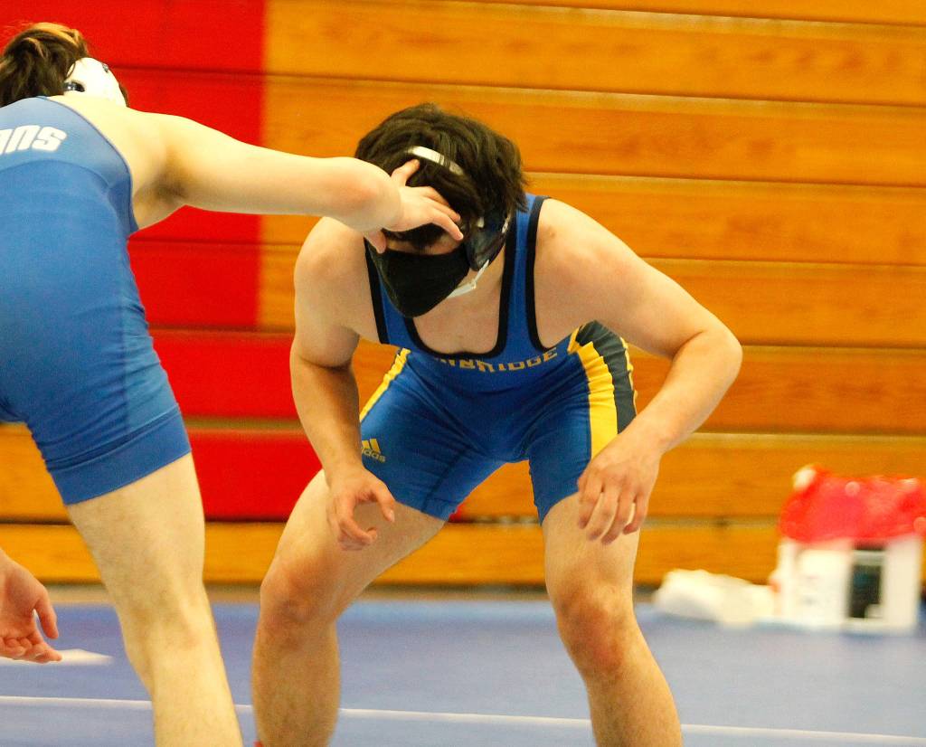 Quentin Ikuse wrestled against Olympic at 152 pounds. (Mark Krulish/Kitsap News Group)