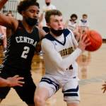 Andrew Ward looks to dish off to a teammate against Central Kitsap. (Mark Krulish/Kitsap News Group)