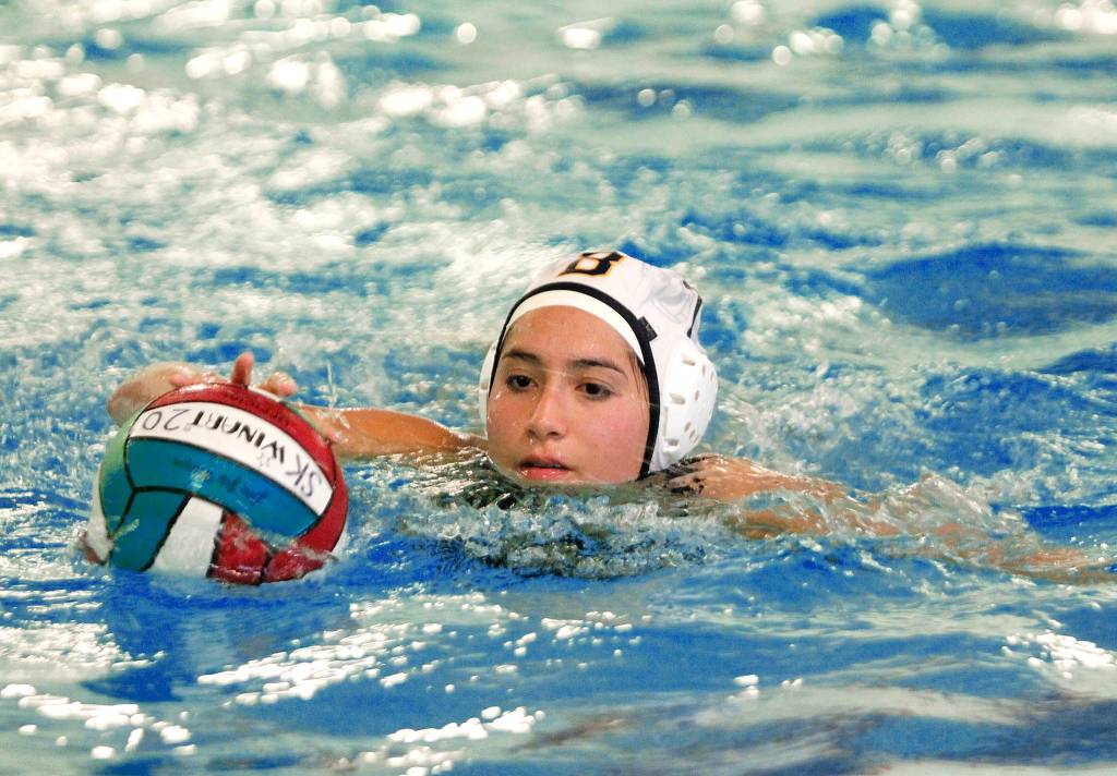 Bainbridges Grace Pratt scoops up a loose ball. (Mark Krulish/Kitsap News Group)