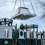 Part of the ferry structure at the playground is put into place. Courtesy Photos