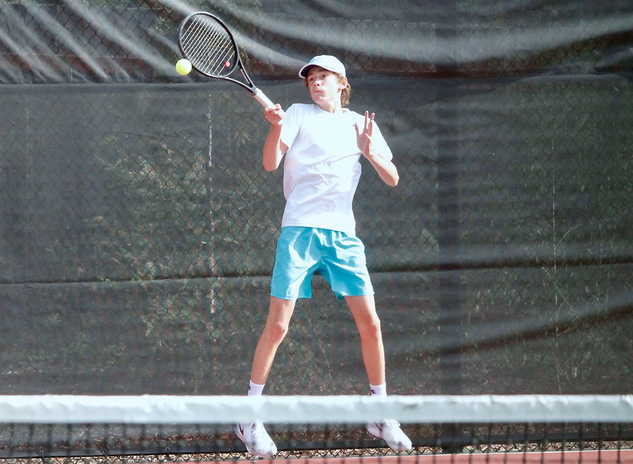 Bainbridges Aiden McLennan goes up to get a high bouncing shot against North Kitsap. (Mark Krulish/Kitsap News Group)