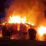 The two-story Kingston home was fully engulfed in flames when firefighters arrived. Courtesy Photos