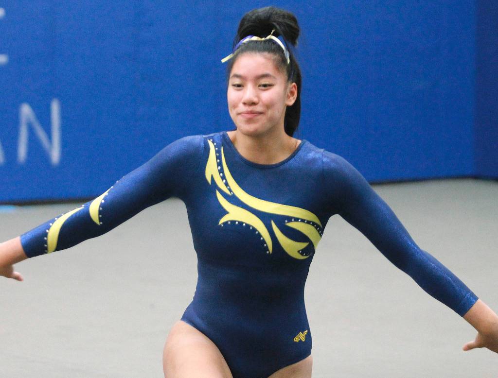 Bainbridge senior Kati Cooper runs through her floor routine. (Mark Krulish/Kitsap News Group)