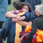A graduate rejoices with loved ones after the ceremony. Tyler Shuey/Bainbridge Island Review