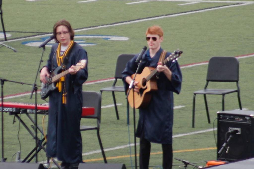 Seniors Mitchell Milander and John Muir performed a song they wrote called "Pushing the Finish Line" at Saturday's graduation. Tyler Shuey/Bainbridge Island Review