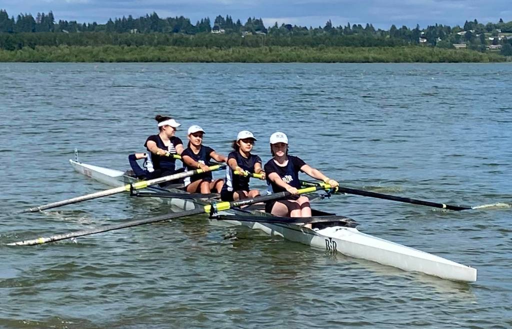 A group of BHS freshmen on the water: Adelaide Poehner, Felicity Watson, Eloise Marshall, Cara Wolf, with sophomore Norah Pearce (coxswain)