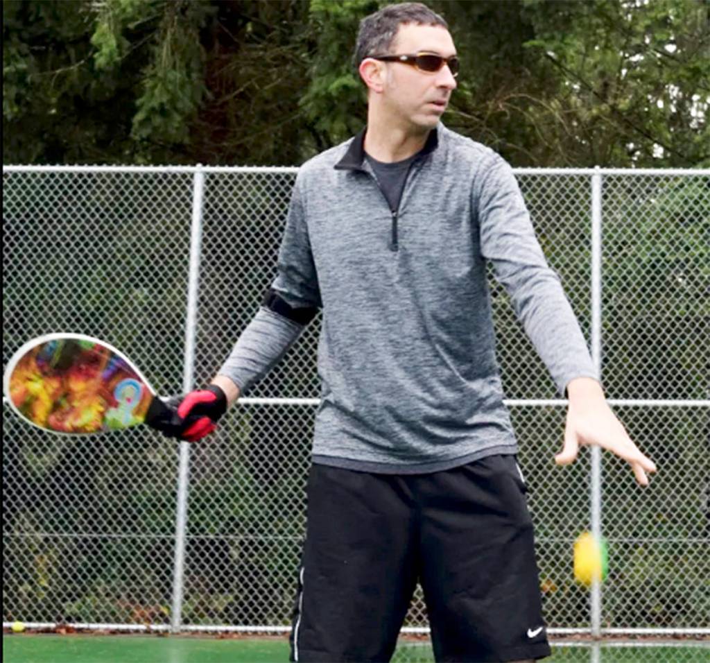 Clint drops the ball to prepare to hit it. Courtesy Photo