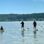 Chad Rounds, Jimmy Lee Burrus and Ryan Hough on the water at the completion of the Warrior Paddle. (Contributed photo)