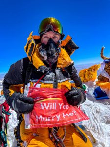 Andrew Hughes with his Will You Marry Me sign atop Mount Everest. Contributed Photos
