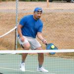 Eyung Gov of Seattle gets across the court to a shot as he and his partner, Lorin Lee, make their way to a bronze medal. (Mark Krulish/Kitsap News Group)