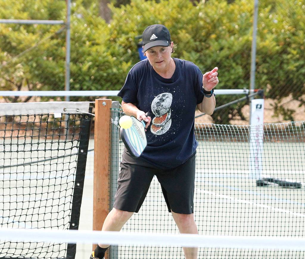 Dana Henry just gets a piece of a shot during a medal match. (Mark Krulish/Kitsap News Group)