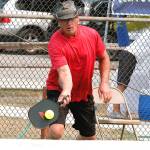 Don Sickle of Bainbridge Island makes a play at the net during a medal match in the Mixed Doubles tournament. Sickle and his partner, Kim Hemingway, won silver in the 3.0, 50+ group. (Mark Krulish/Kitsap News Group)