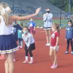 Young campers look a little confused as BHS varsity cheerleaders perform the beginning of the routine.