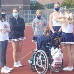 Members of the Spirit Squad wait for others to join in before learning their cheers.