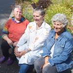 Colleen Keilbart, Alice Mendoza and Ann Lovejoy in front of the garden at the senior center. Steve Powell/Bainbridge Island Review
