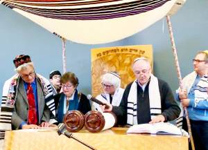 Rabbi Darío presides over the reading of the Torah during a bar mitzvah service. Courtesy Photos CKS