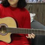 A female guitarist in Afghanistan.
