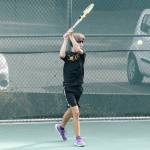 NK freshman Indigo Gallagher Zapf returns serve in his singles match against Bainbridge. (Mark Krulish/Kitsap News Group)