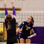 Allie Wildsmith of Bainbridge blasts a shot through the North Kitsap defense during her teams five-set win on Thursday night. (Mark Krulish/Kitsap News Group)