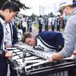 Director Chris Thomas, with help from percussion section, tries to fix the xylophone.