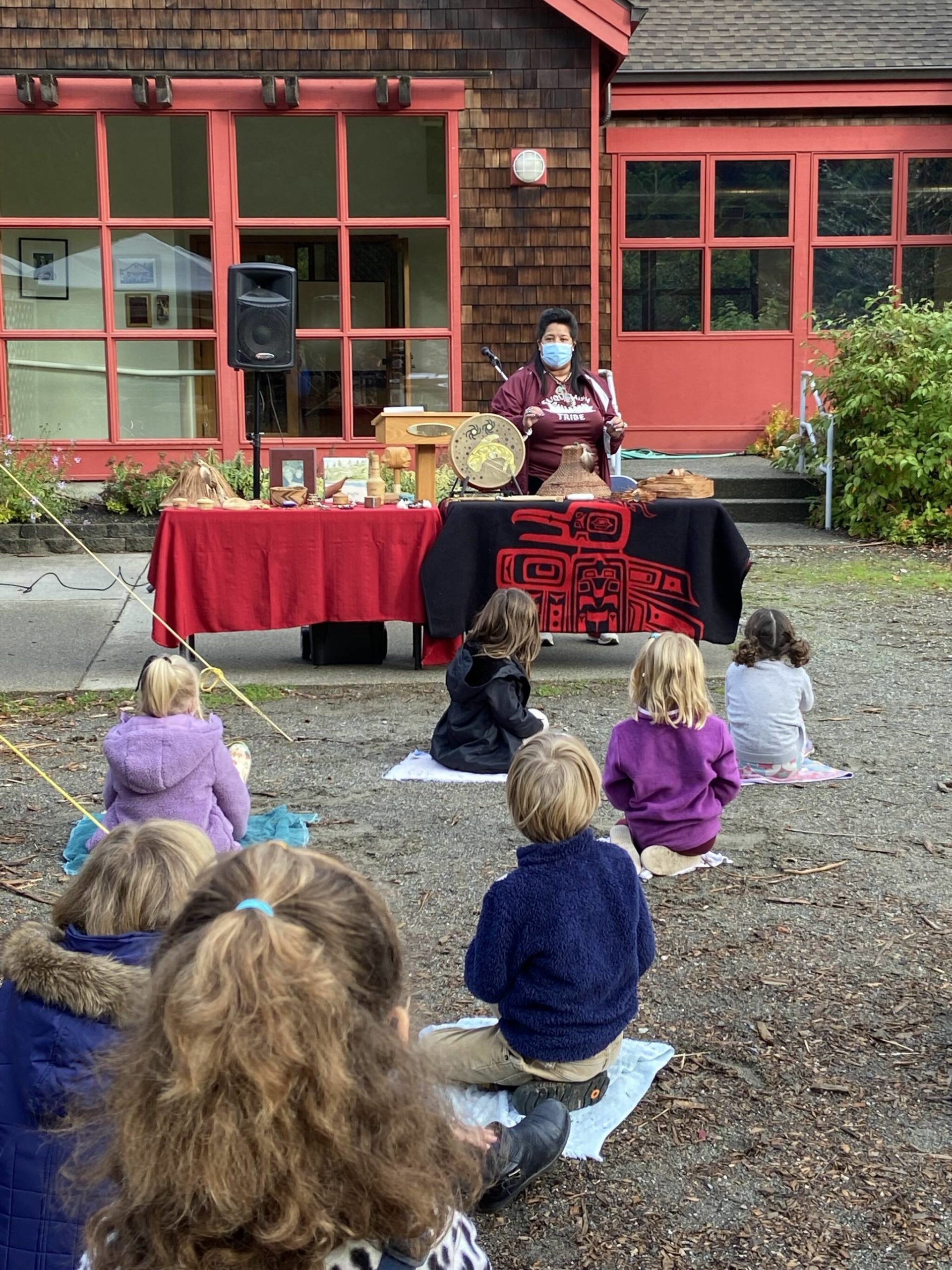 To celebrate Indigenous Peoples Day Oct. 11, Celeste Loneia, a Suquamish artist and master weaver, teaches students at Island School about the uses of cedar and the role people play in protecting natural resources. She also made fry bread. First-graders read a story about salmon and other students shared information they learned about things like snowshoes and also played music by Suquamish artist Calina Lawrence. Courtesy Photo