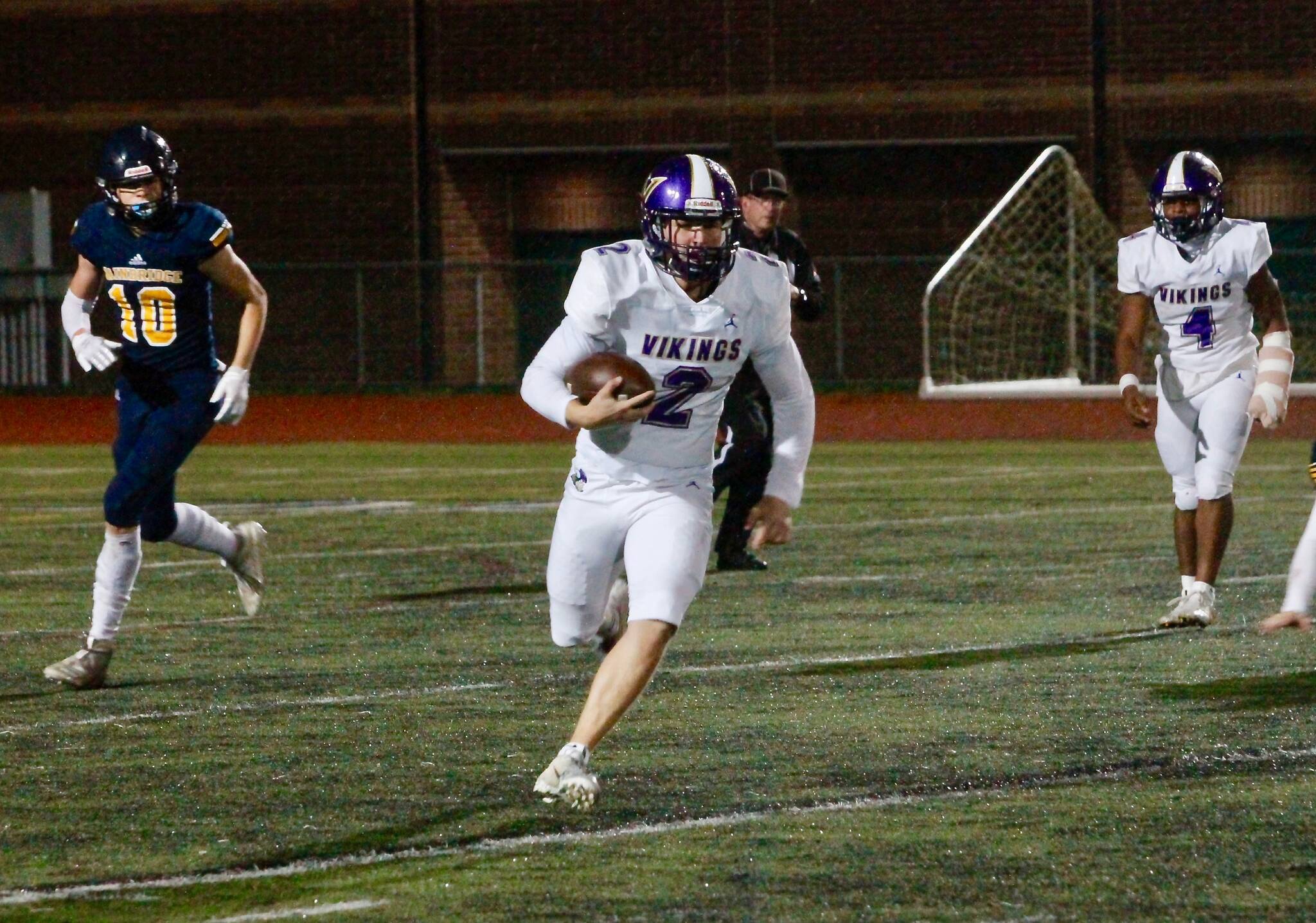 The North Kitsap passing game struggled Thursday, but quarterback Colton Bower rushed for 133 yards and two touchdowns in his teams 32-0 win over Bainbridge. (Mark Krulish/Kitsap News Group)
